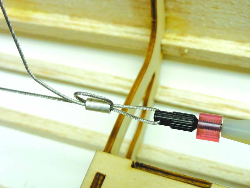 Looping the pull-pull cable through the ferrule ensures that the cable will not pull loose after it’s crimped in place.